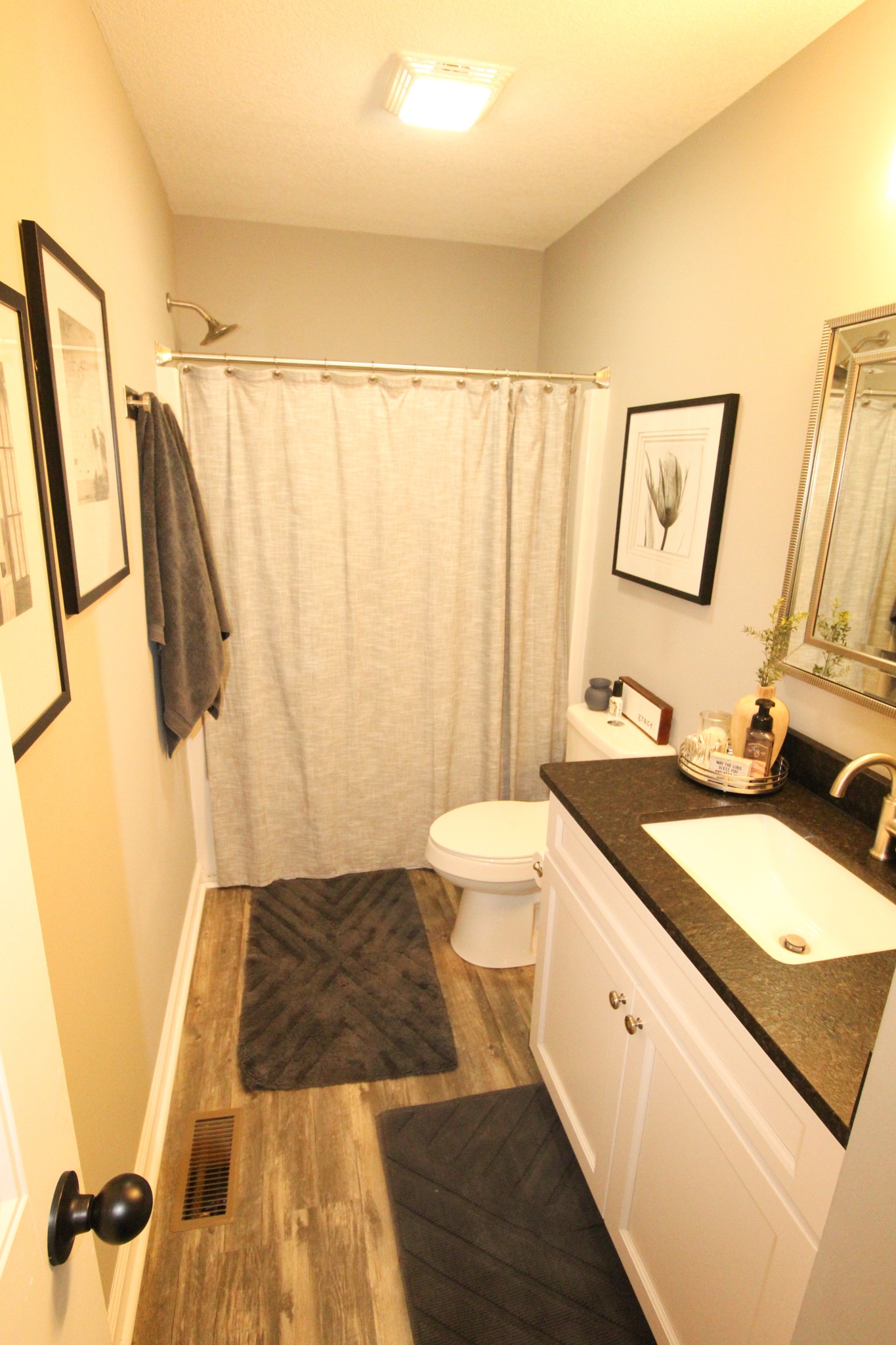 128 East Carter Road Portland, TN 37148 - Photo 15 of 26 a spacious bathroom with a granite countertop sink and a mirror