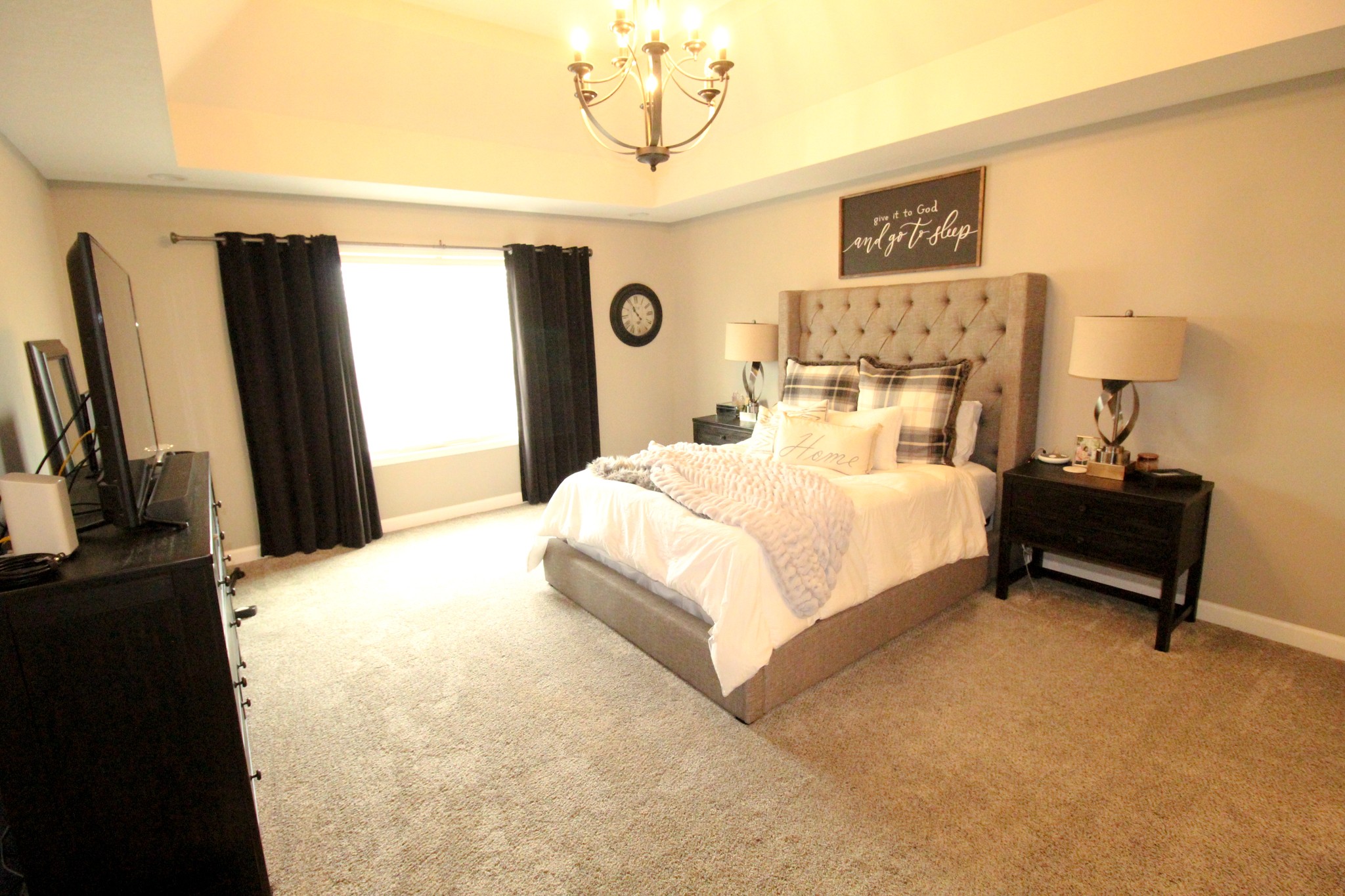 128 East Carter Road Portland, TN 37148 - Photo 17 of 26 a bedroom with a bed and a flat tv screen on the dresser