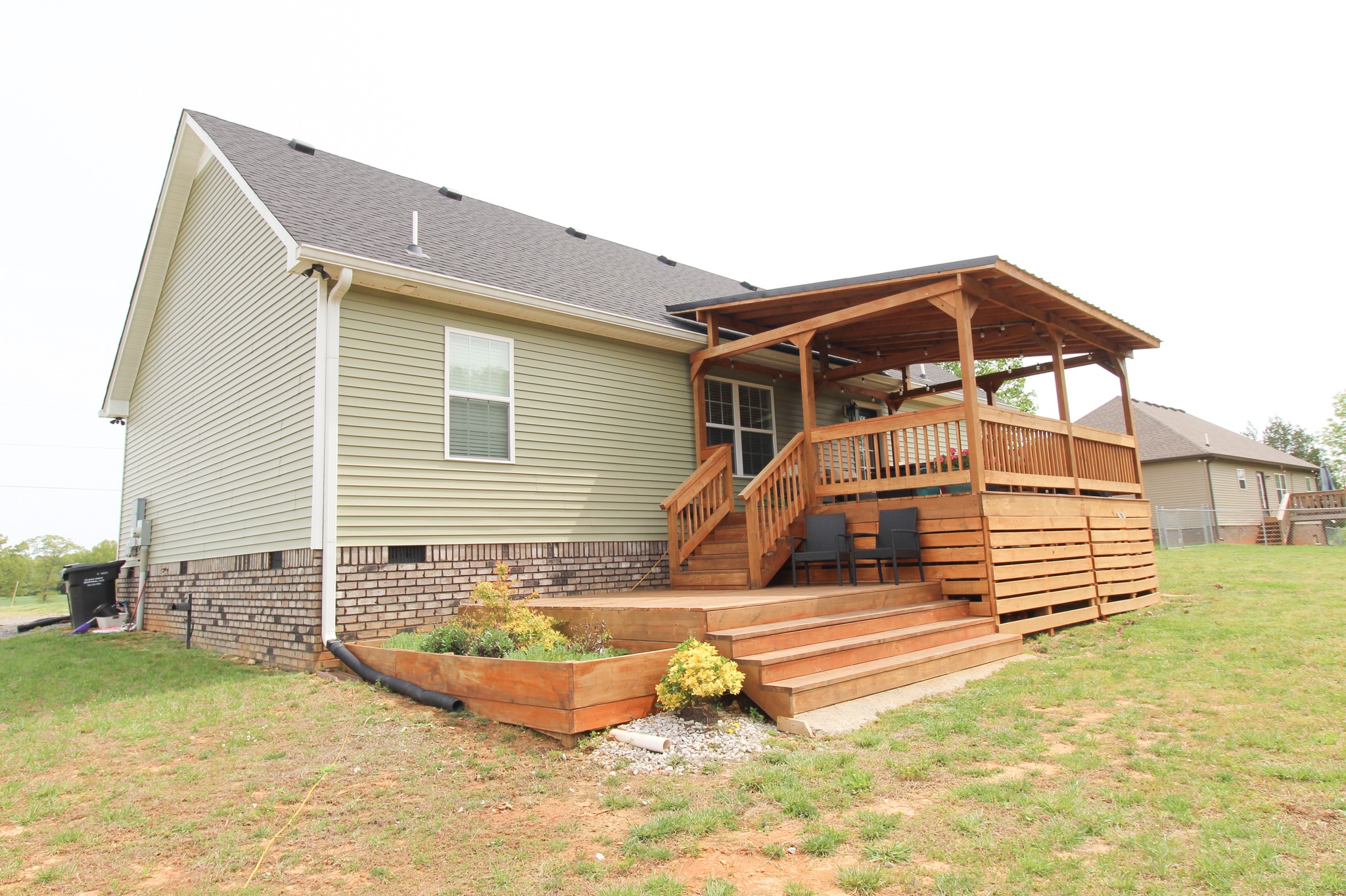 128 East Carter Road Portland, TN 37148 - Photo 22 of 26 a front view of a house with a garden
