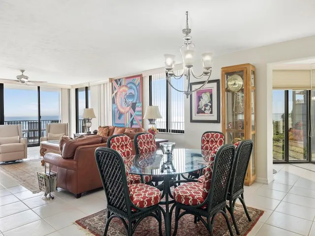 a view of a dining room with furniture chandelier and a chandelier