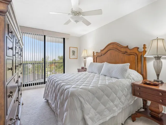 a bedroom with a bed and a tv