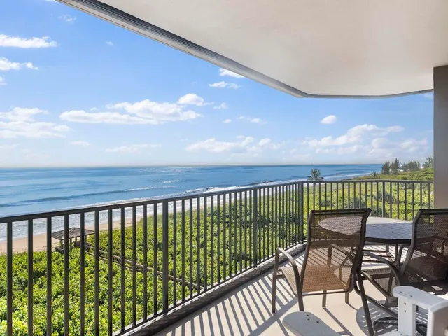 a view of a balcony with a chair
