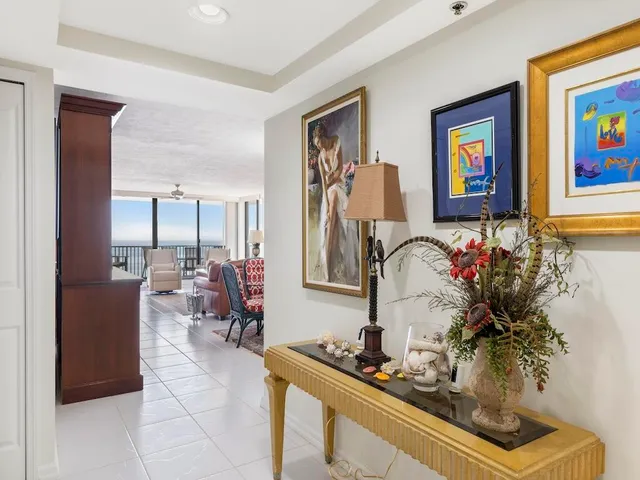 a living room with furniture flowerpot and flower pot