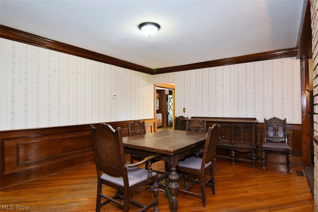 7251 Ryan Road Medina, OH 44256 - Photo 4 of 47 Hardwood flooring complements a decorative wood wainscoting and crown molding
