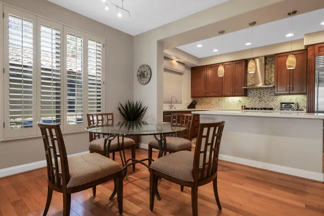 a view of a dining room with furniture and window
