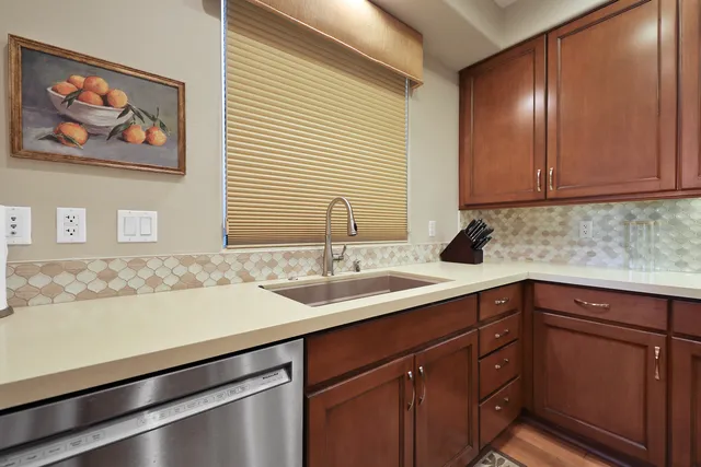 a kitchen with a sink and cabinets