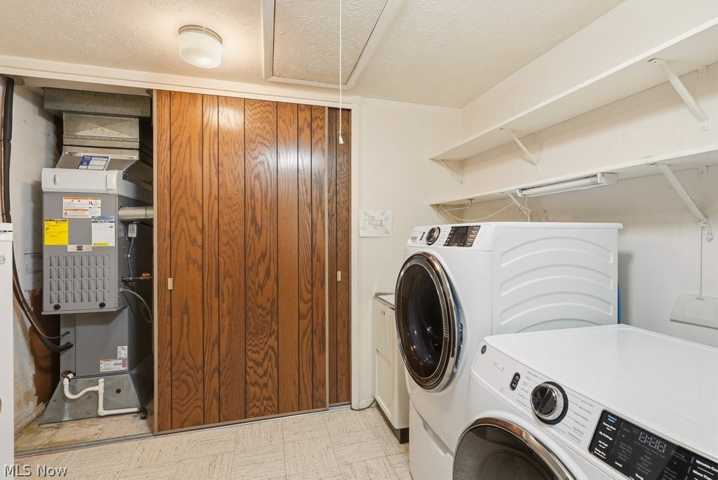 17482 Falling Water Road Strongsville, OH 44136 - Photo 26 of 33 Laundry room with laundry tub and mechanicals closet