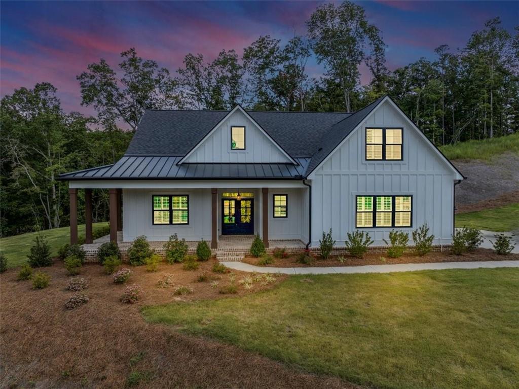 388 Oxford Road Ball Ground, GA 30107 - Photo 2 of 55 a front view of a house with a yard