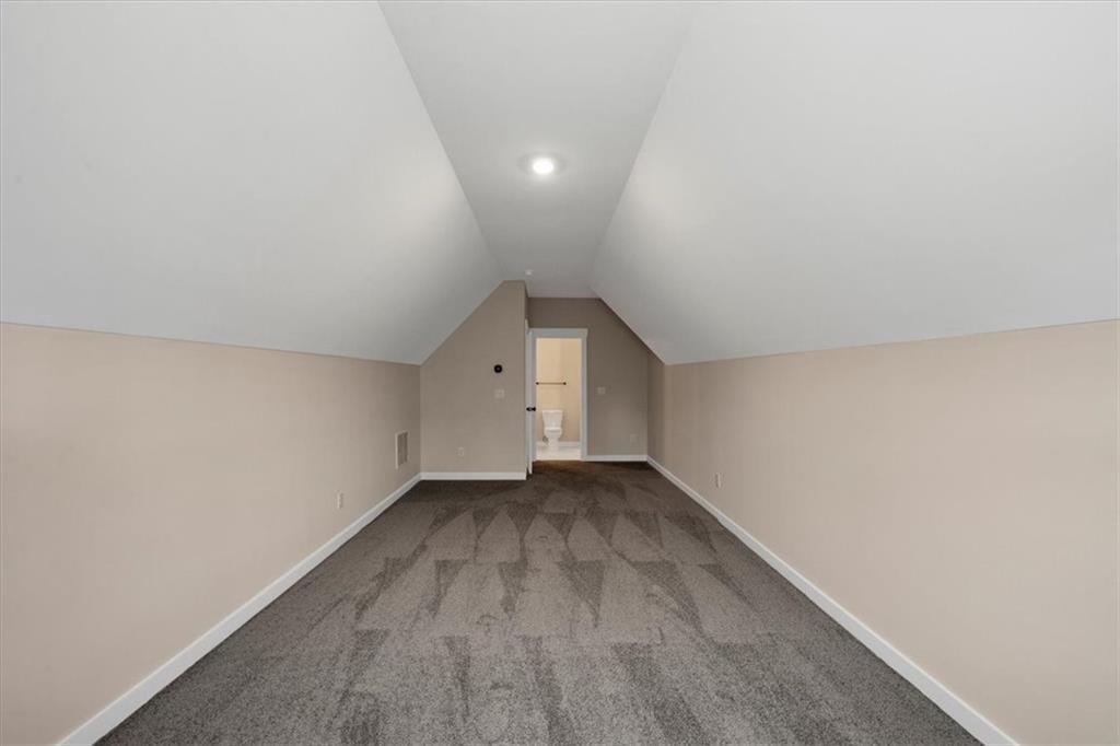 388 Oxford Road Ball Ground, GA 30107 - Photo 41 of 55 an empty room with wooden floor and windows