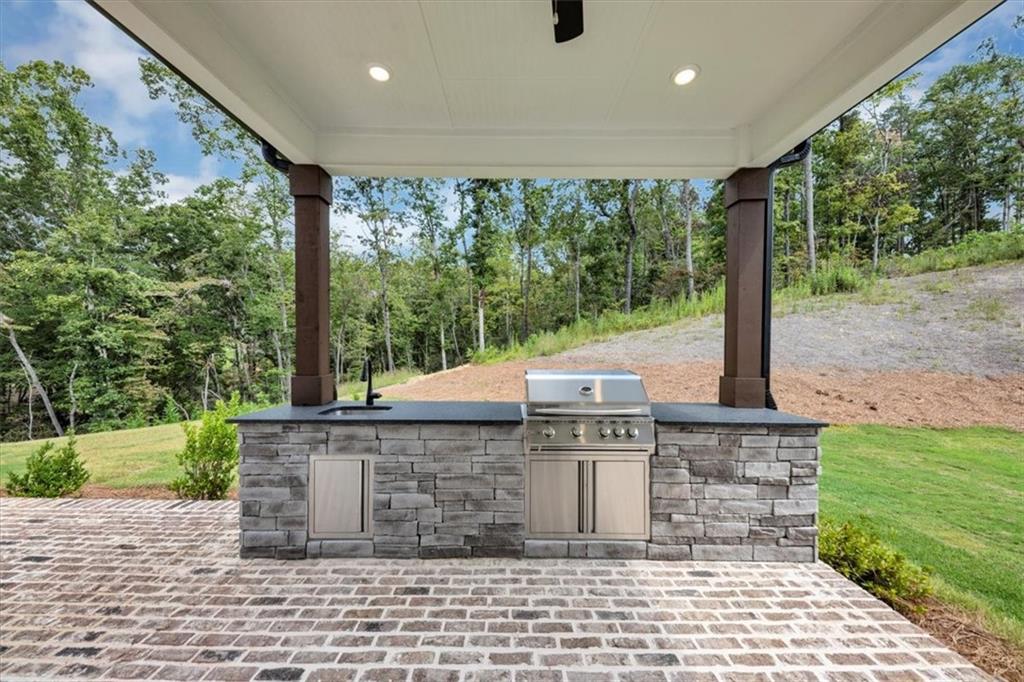 388 Oxford Road Ball Ground, GA 30107 - Photo 44 of 55 a view of a patio with a table and chairs