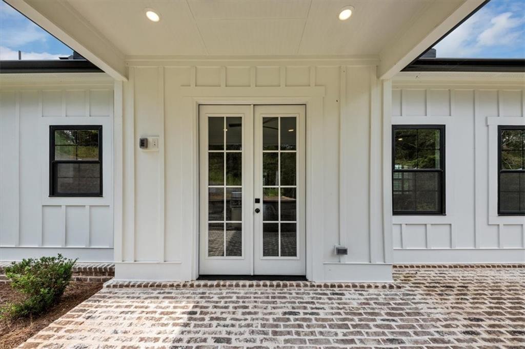 388 Oxford Road Ball Ground, GA 30107 - Photo 46 of 55 a view of a brick house with a window