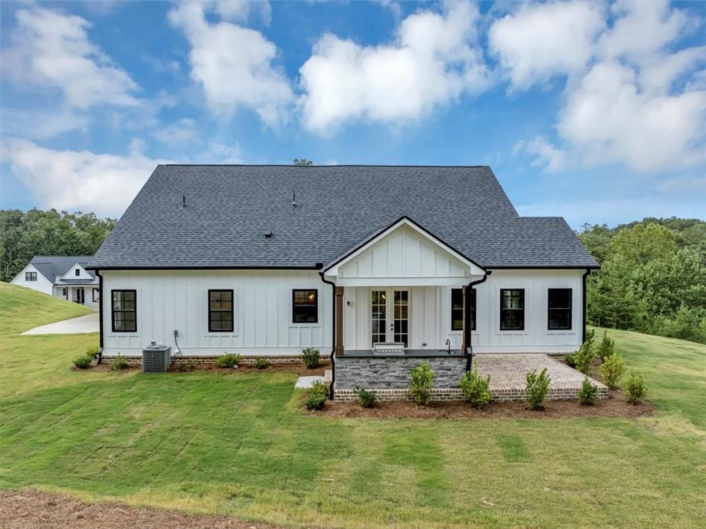 388 Oxford Road Ball Ground, GA 30107 - Photo 48 of 55 a front view of a house with a yard