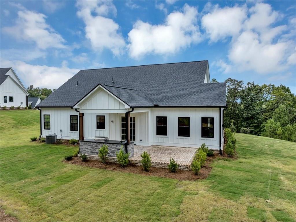 388 Oxford Road Ball Ground, GA 30107 - Photo 49 of 55 a front view of house with yard and green space