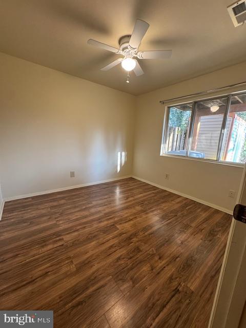 3621 Seaford Court Pasadena, MD 21122 - Photo 18 of 25 an empty room with wooden floor and windows