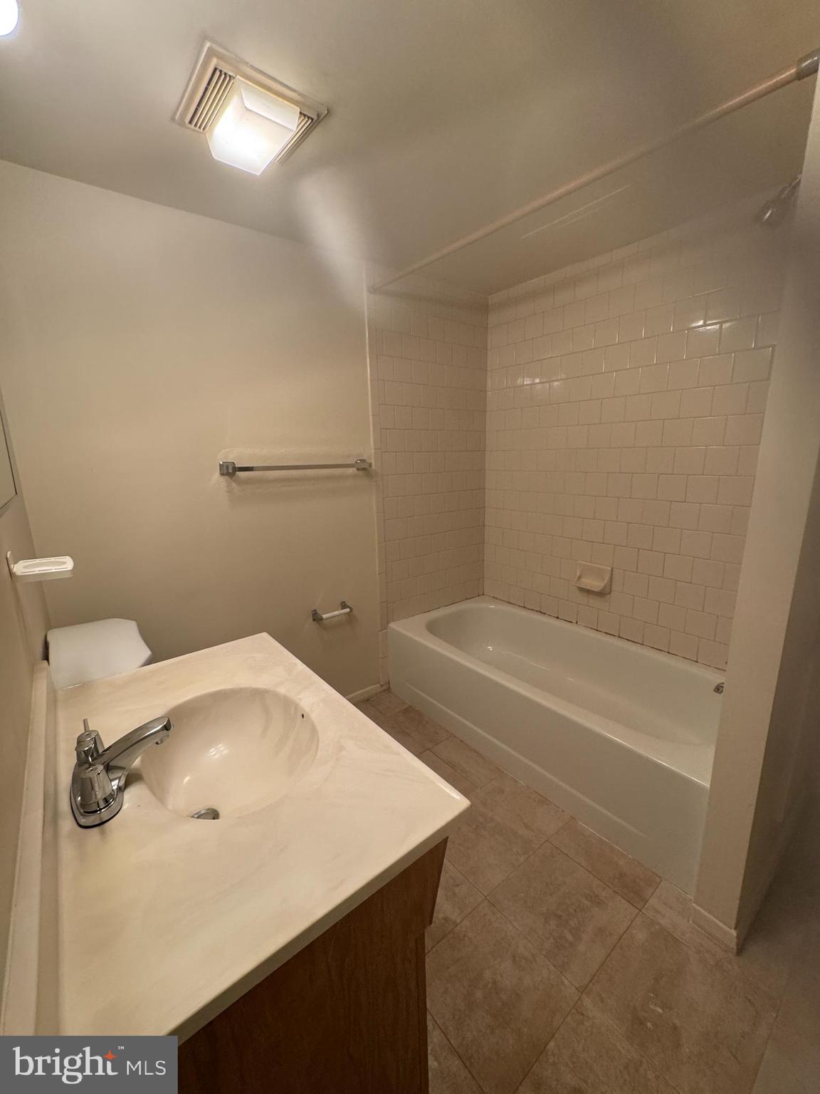 3621 Seaford Court Pasadena, MD 21122 - Photo 20 of 25 a bathroom with a tub sink and vanity