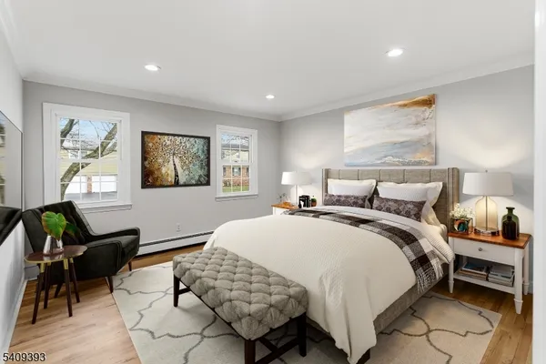 a bedroom with bed and a window