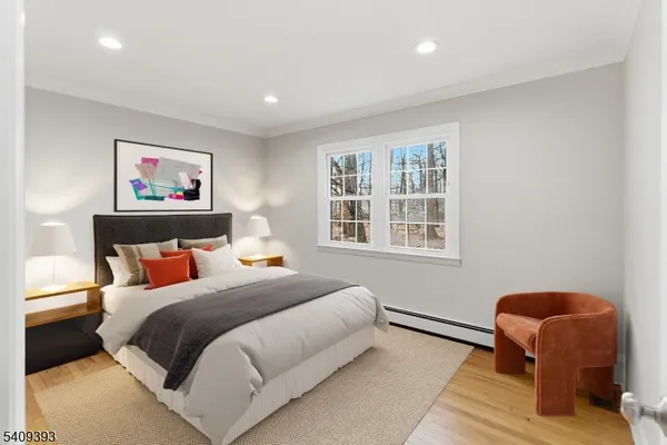 a bedroom with bed and a window