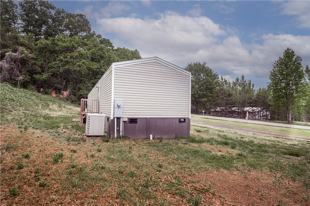 1188 Old Liberty Road Easley, SC 29640 - Photo 5 of 28 This tranquil setting offers a manufactured home with a spacious yard and wooded backdrop.