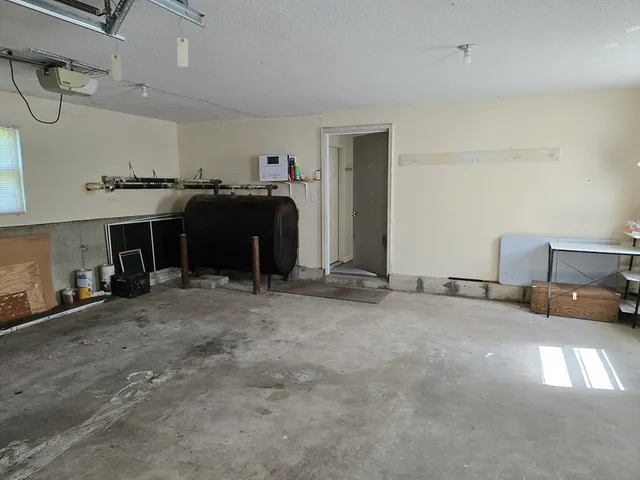 a view of a livingroom with furniture and a fireplace