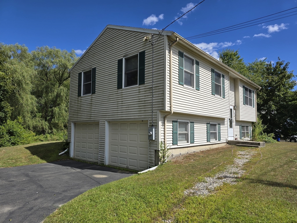 146 Old Amherst Road Sunderland, MA 01375 - Photo 2 of 16 a front view of a house with a yard