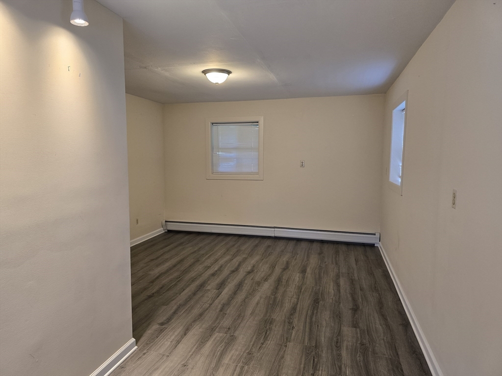 146 Old Amherst Road Sunderland, MA 01375 - Photo 10 of 16 a view of an empty room with wooden floor