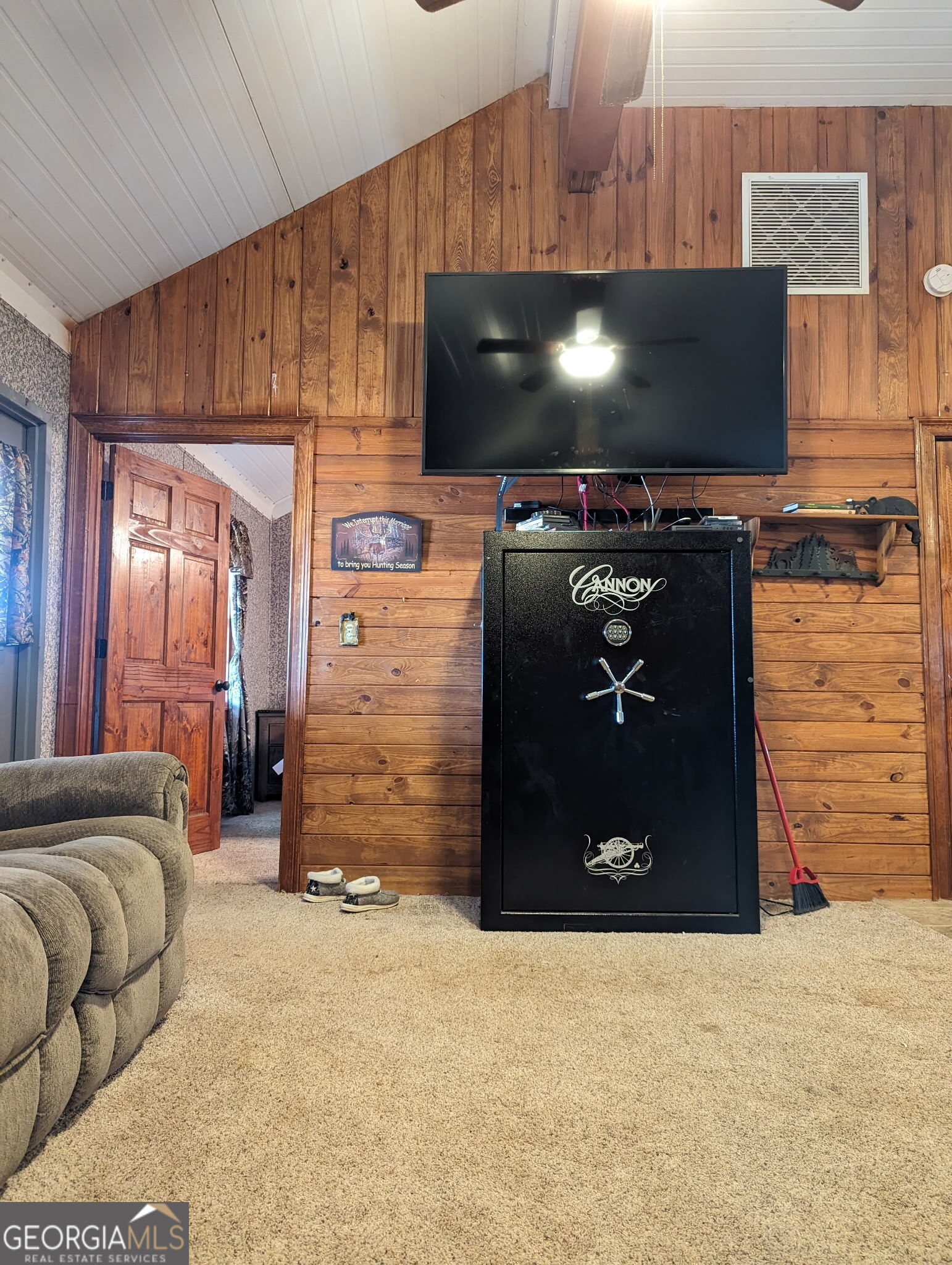 3841 Wilson Road Davisboro, GA 31018 - Photo 29 of 37 a living room with furniture and a flat screen tv
