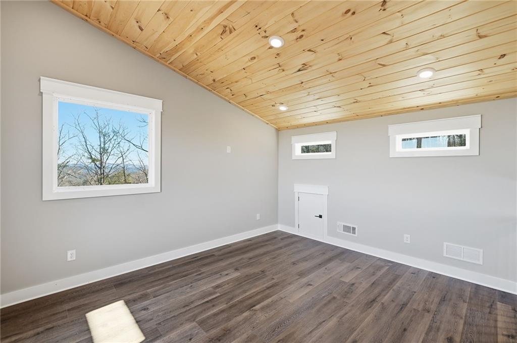 1176 Jewel Court Northeast Ranger, GA 30734 - Photo 17 of 53 a view of empty room with wooden floor