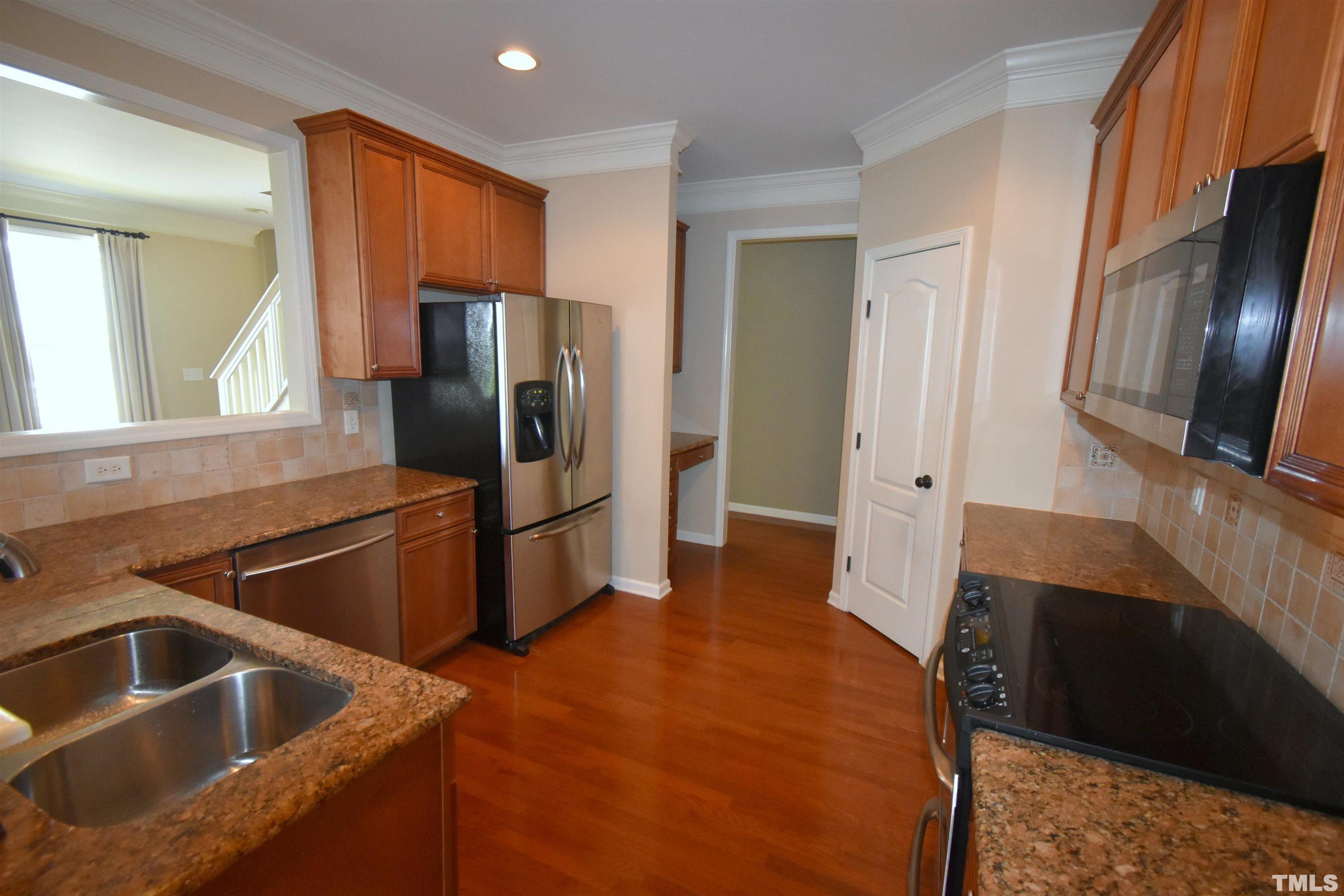 2019 Sinclair Trace Burlington, NC 27215 - Photo 13 of 32 a kitchen with a refrigerator sink and microwave