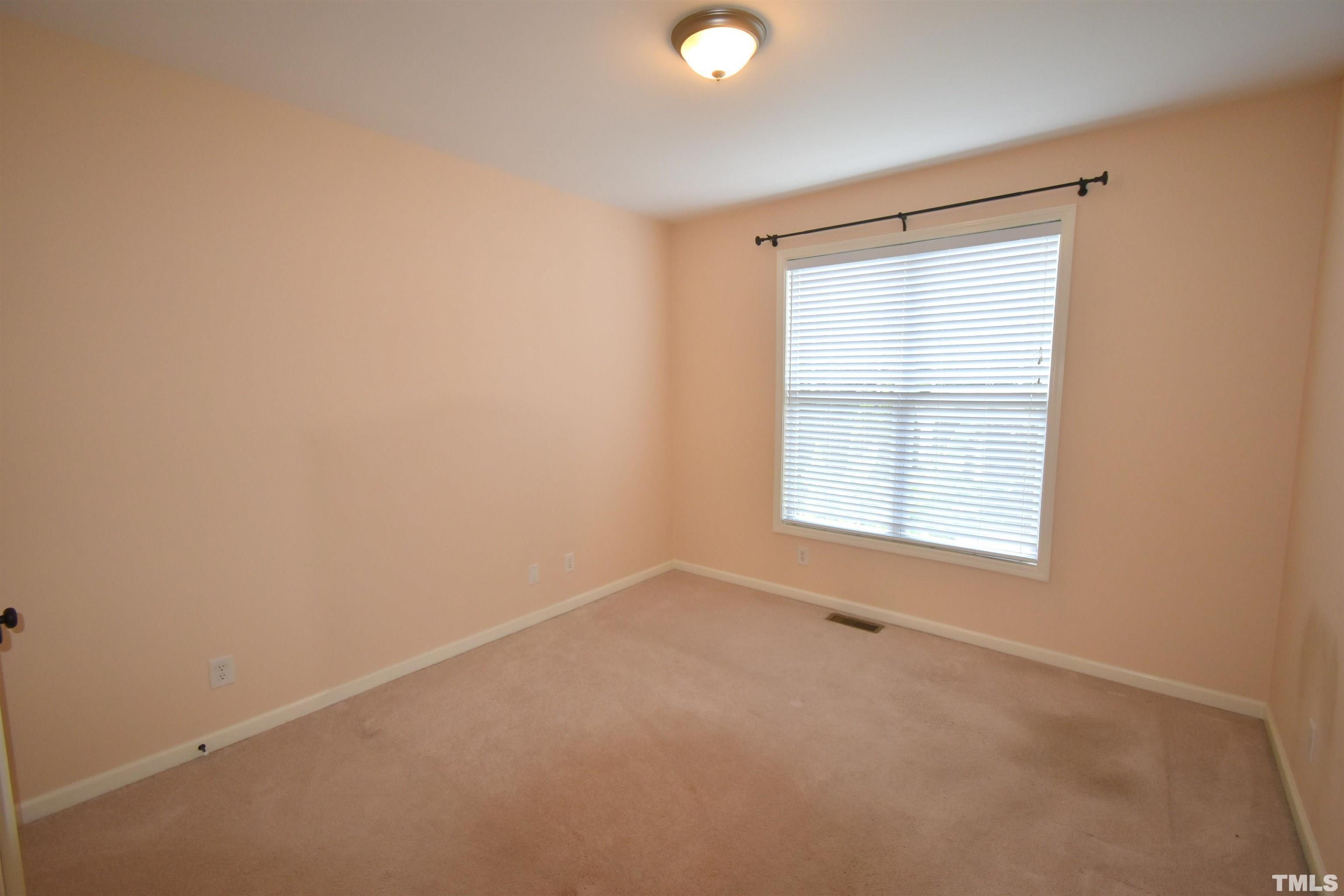 2019 Sinclair Trace Burlington, NC 27215 - Photo 15 of 32 an empty room with a window
