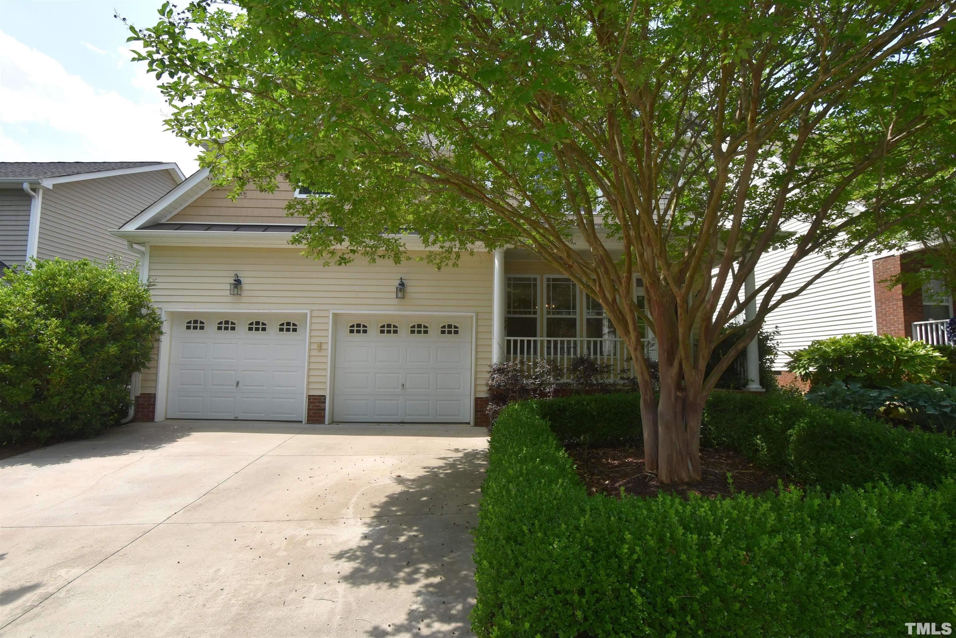 2019 Sinclair Trace Burlington, NC 27215 - Photo 3 of 32 a front view of a house with a garden