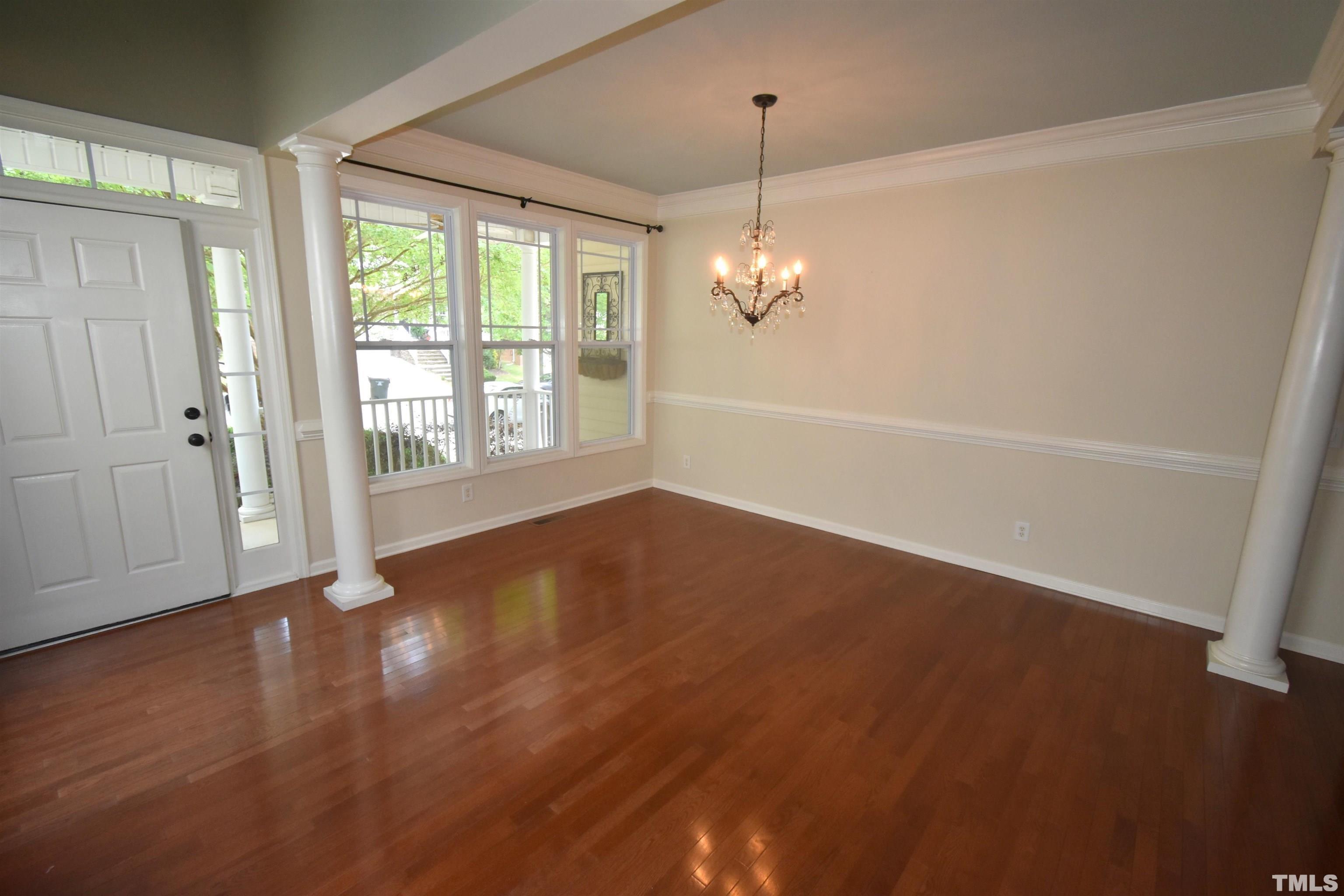 2019 Sinclair Trace Burlington, NC 27215 - Photo 4 of 32 an empty room with wooden floor and windows
