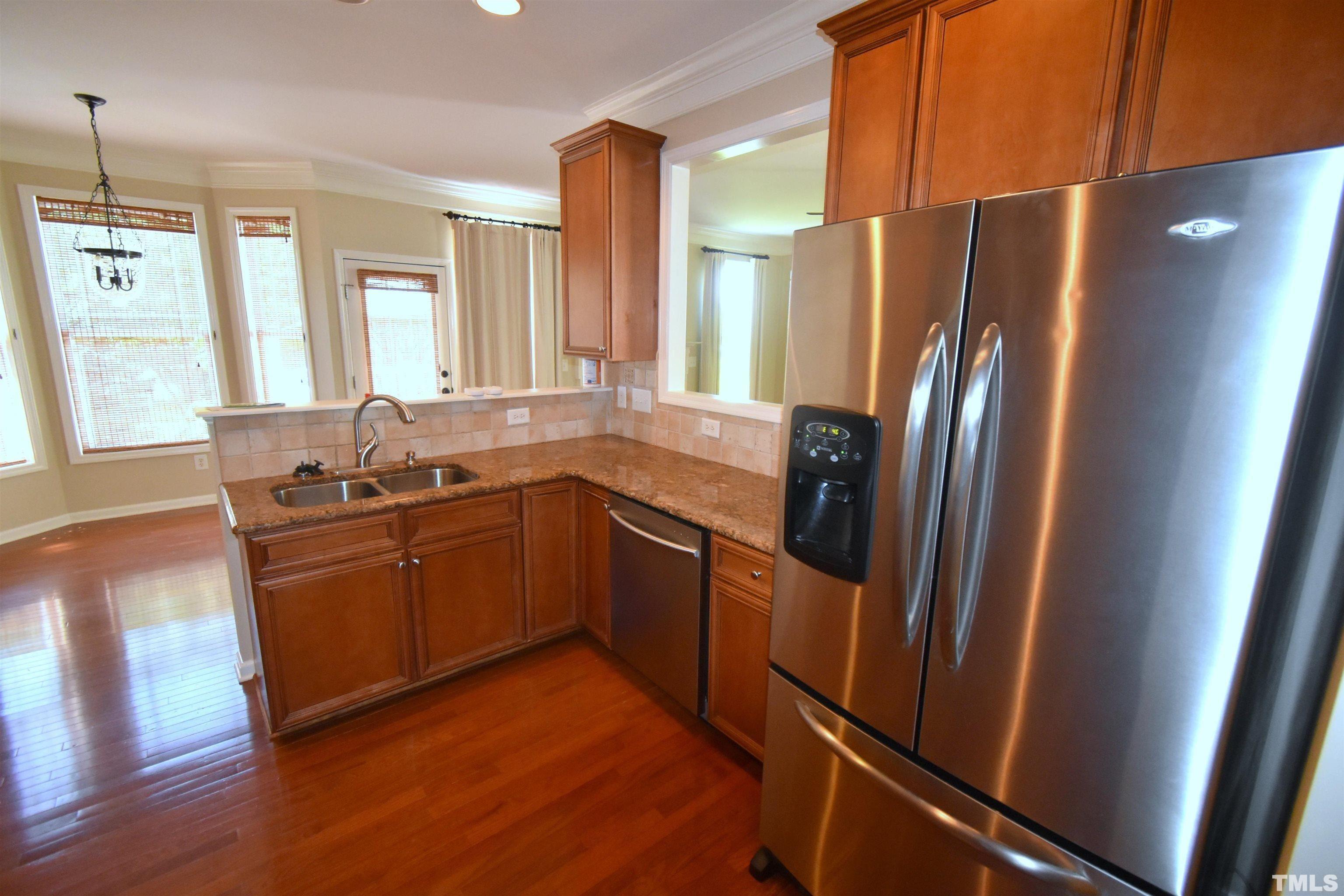 2019 Sinclair Trace Burlington, NC 27215 - Photo 9 of 32 a kitchen with stainless steel appliances granite countertop a refrigerator and a sink