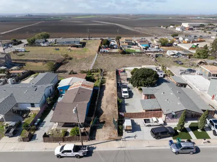 an aerial view of multiple houses with outdoor space