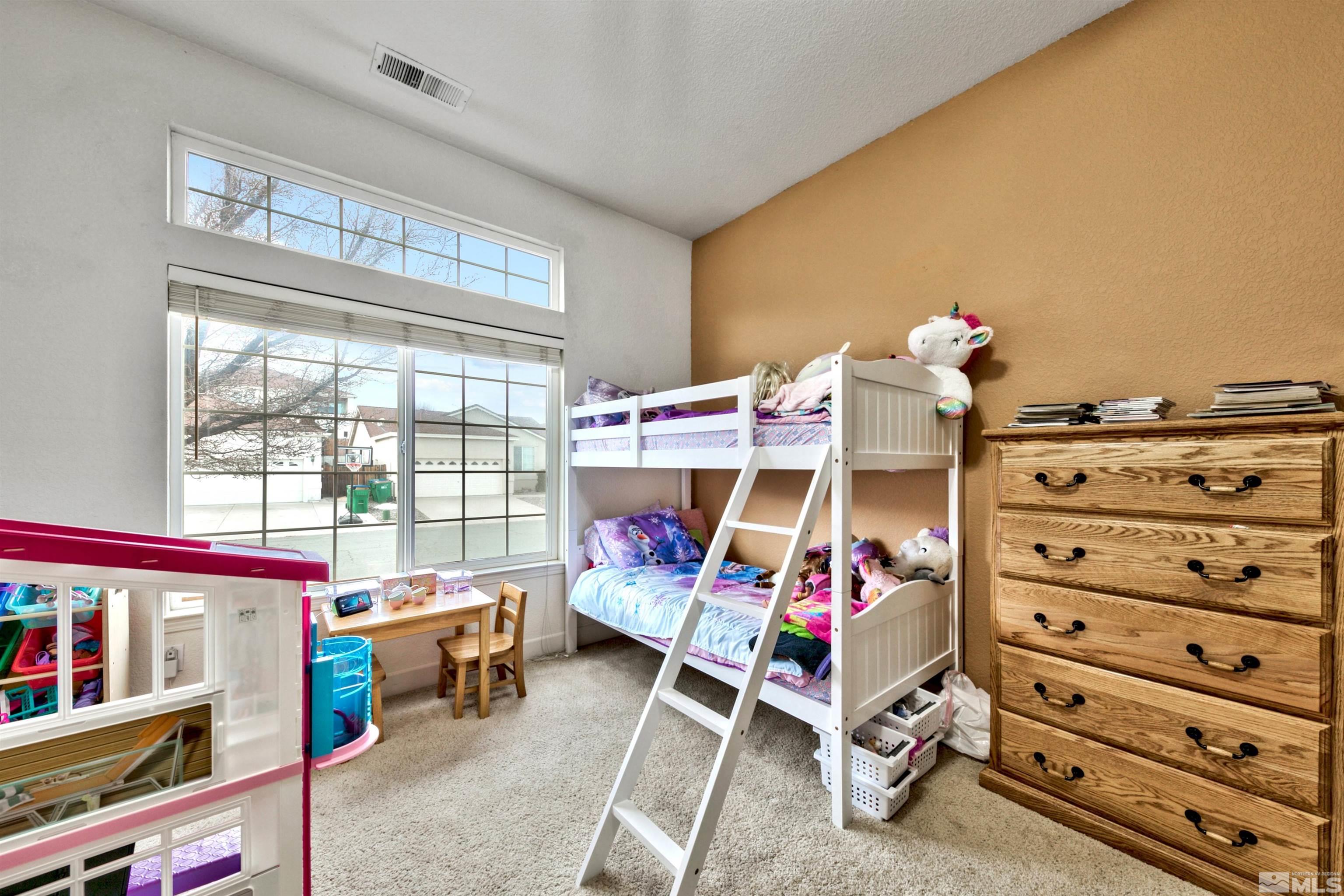 2831 Longridge Drive Carson City, NV 89706 - Photo 19 of 27 a bedroom with furniture and a window