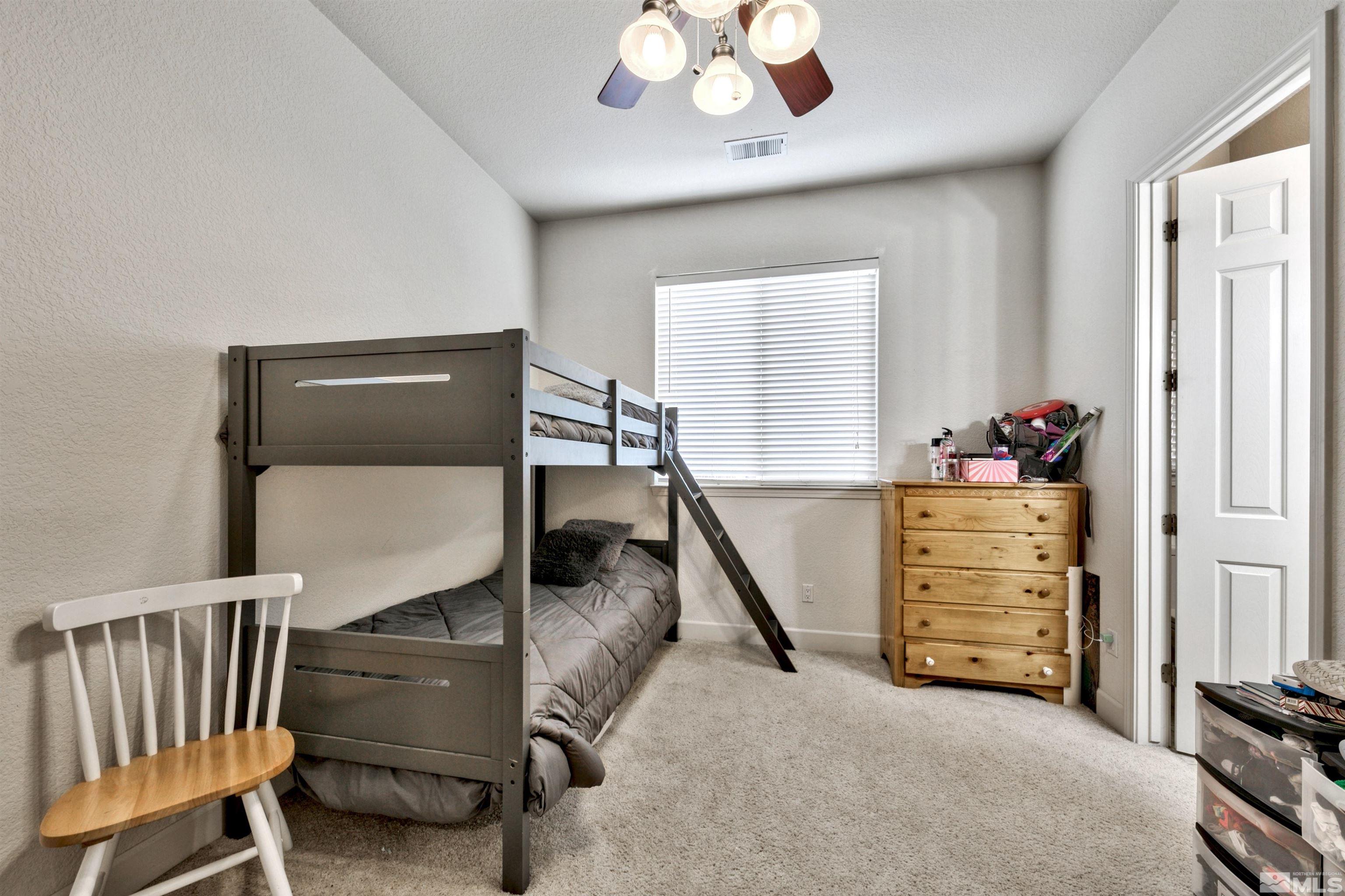 2831 Longridge Drive Carson City, NV 89706 - Photo 22 of 27 a bedroom with furniture and a window