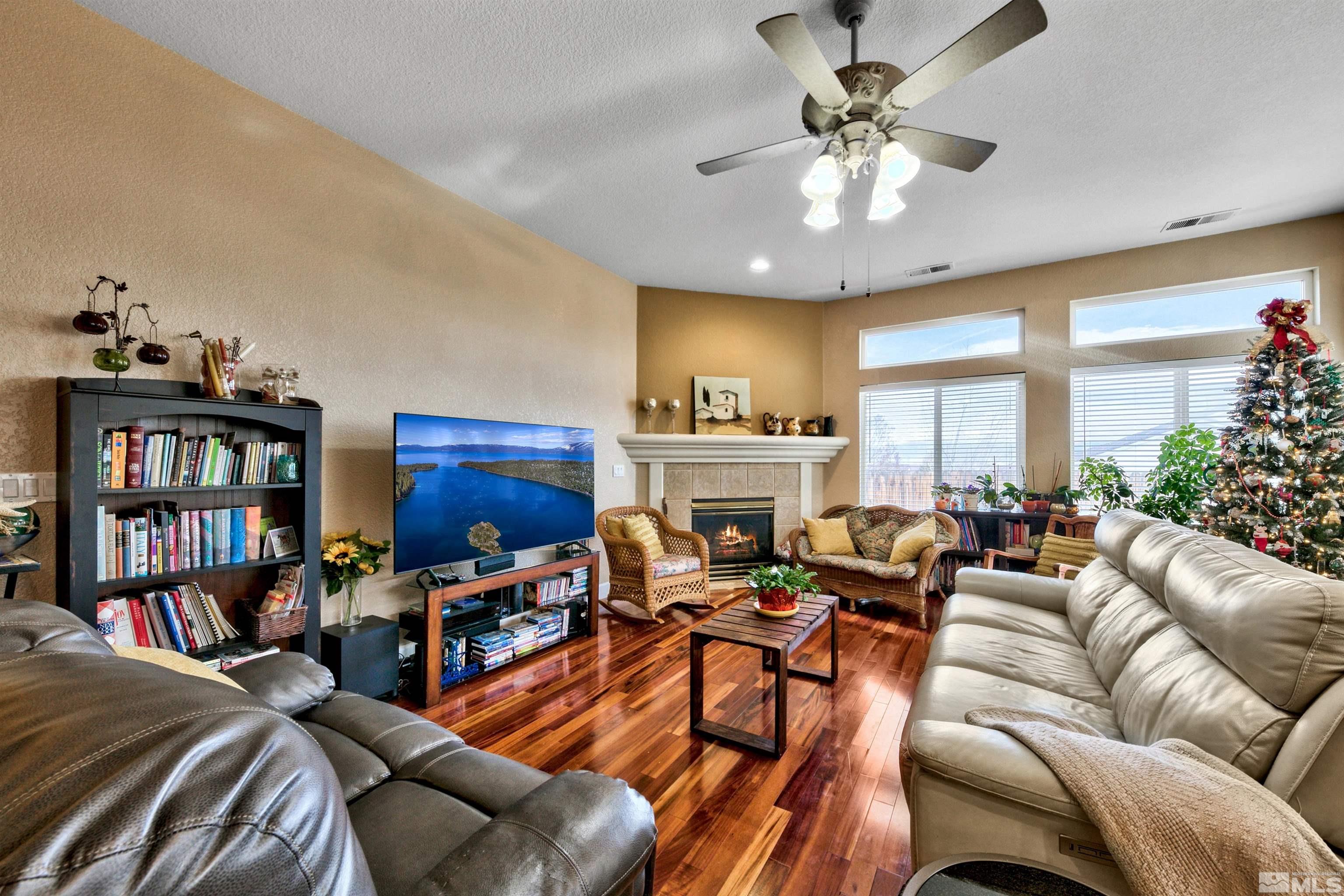 2831 Longridge Drive Carson City, NV 89706 - Photo 4 of 27 a living room with furniture a bookshelf and a bookshelf
