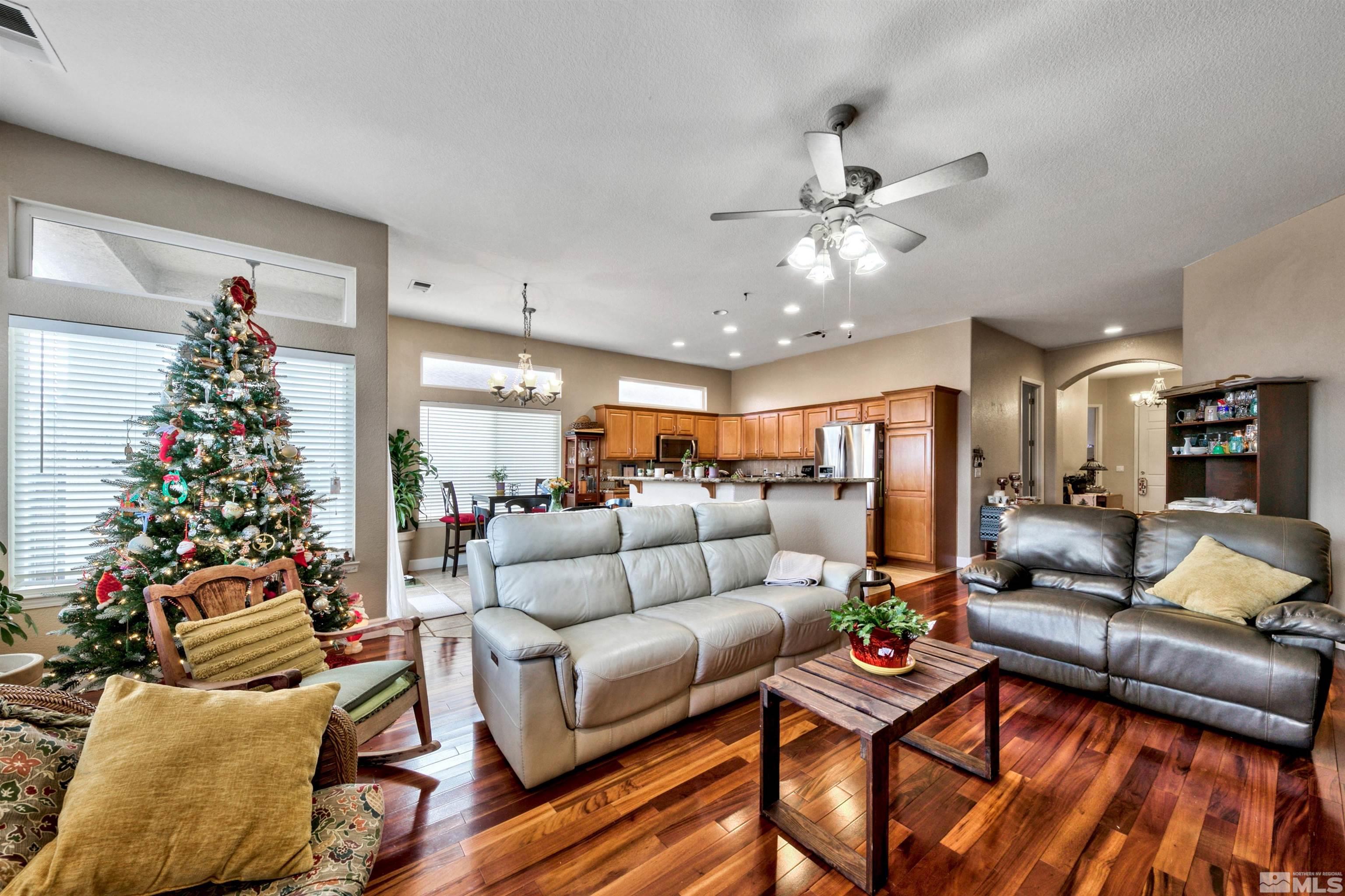 2831 Longridge Drive Carson City, NV 89706 - Photo 6 of 27 a living room with furniture and flowers