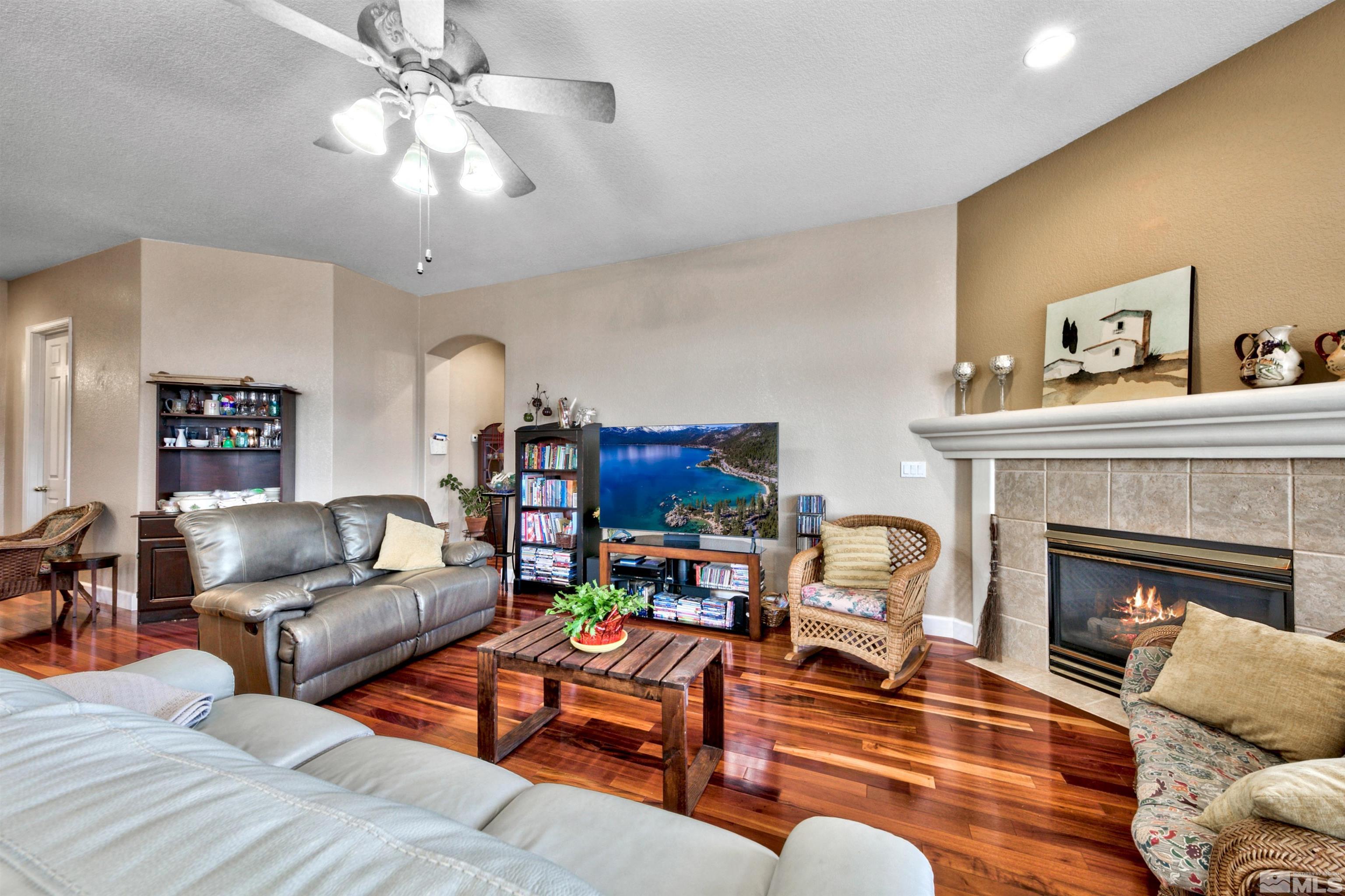 2831 Longridge Drive Carson City, NV 89706 - Photo 7 of 27 a living room with furniture and a fireplace