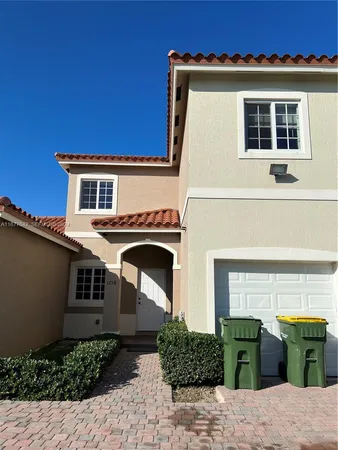 a front view of a house with outdoor space