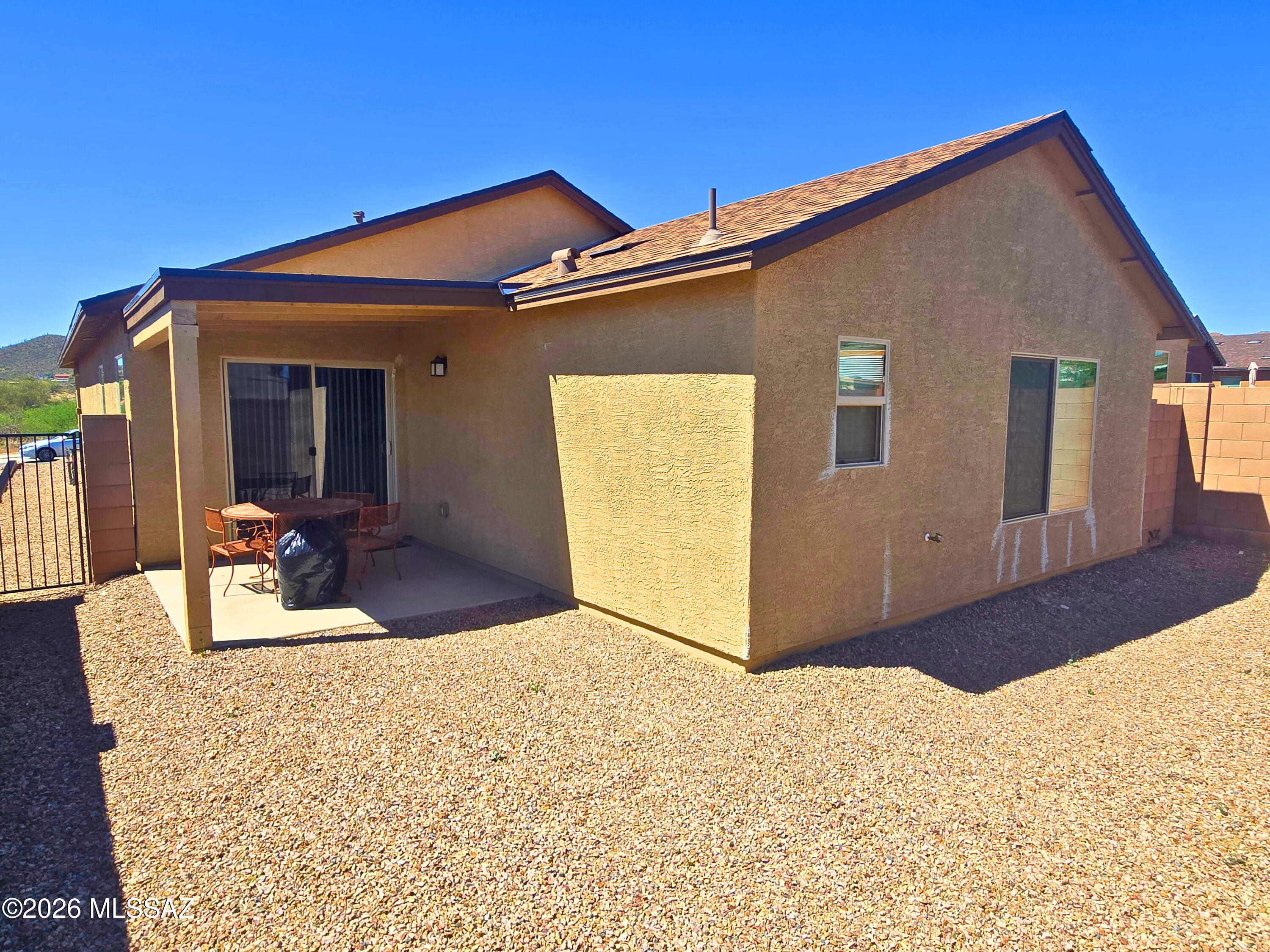 6343 South Rigby Way Tucson, AZ 85746 - Photo 23 of 29 a view of a house with wooden fence