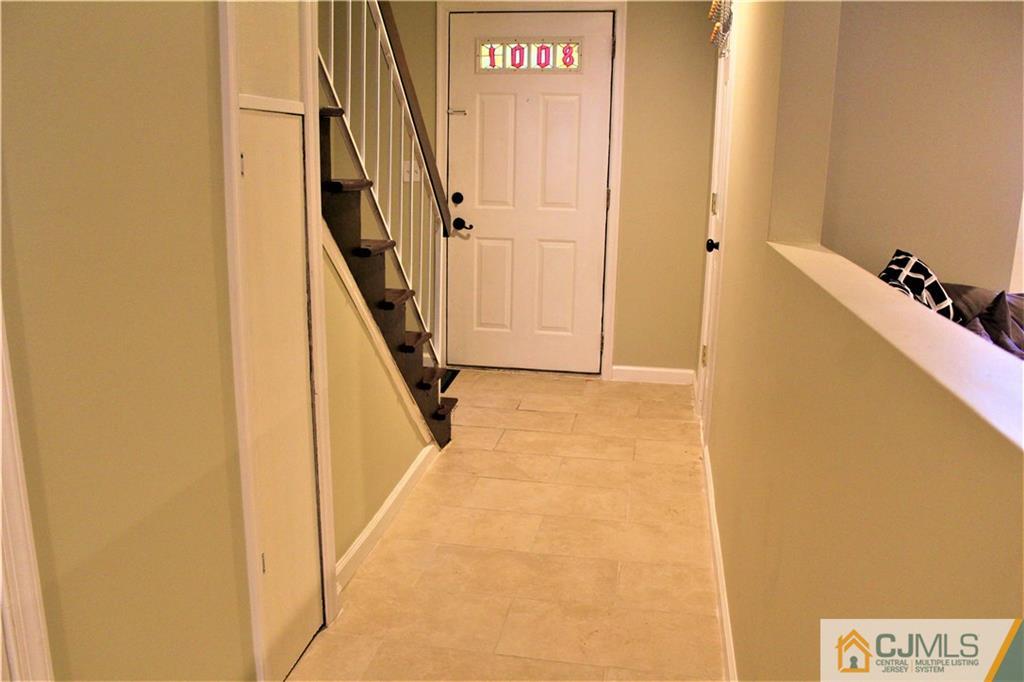 8001 Hana Road Edison, NJ 08817 - Photo 22 of 25 a view of hallway with stairs