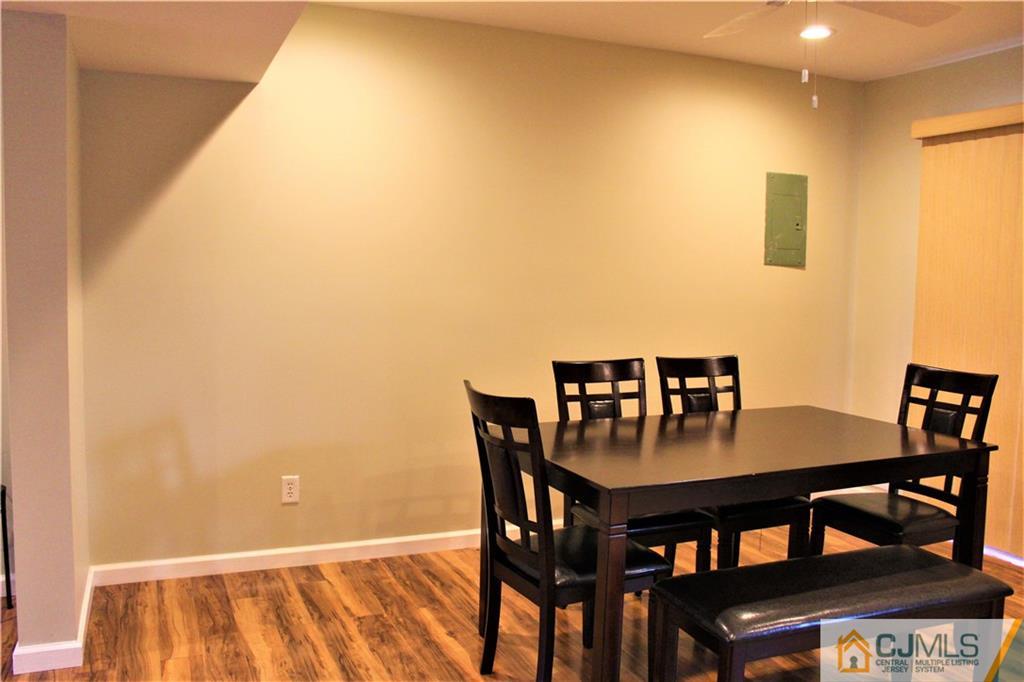 8001 Hana Road Edison, NJ 08817 - Photo 8 of 25 a view of a dining room with furniture and wooden floor