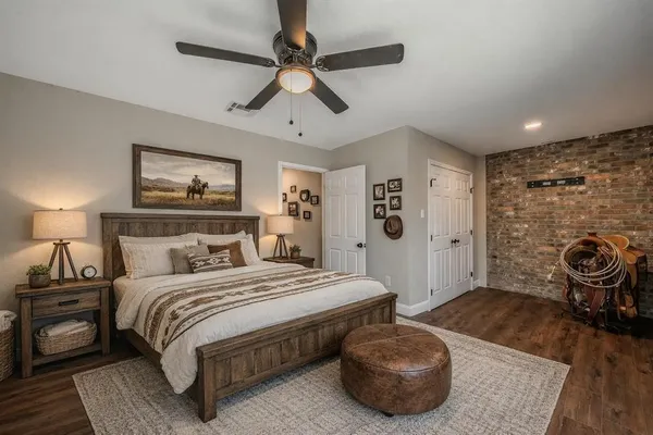 a bedroom with a bed and a chandelier