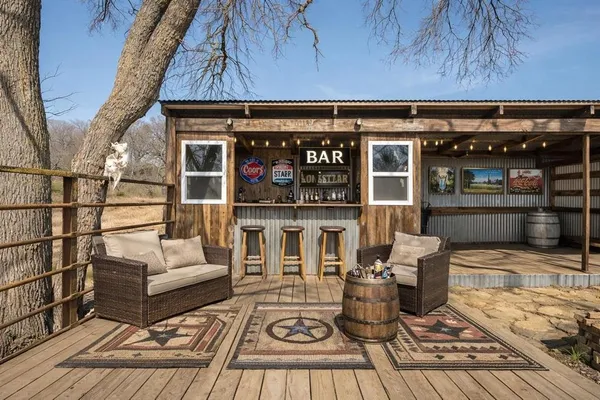 a view of a chairs and table on the wooden floor