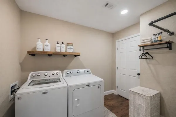 a utility room with dryer and washer
