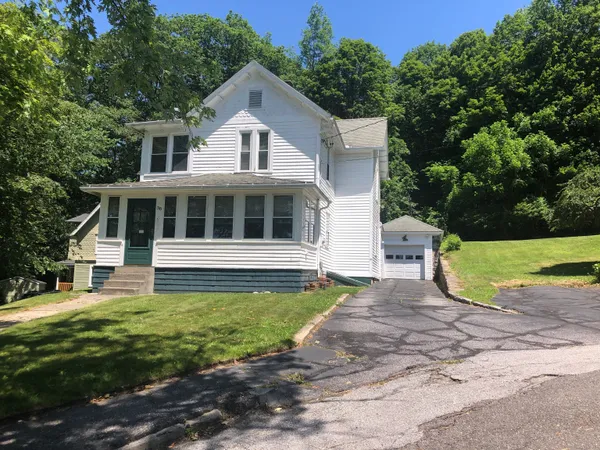 a view of a house with a yard