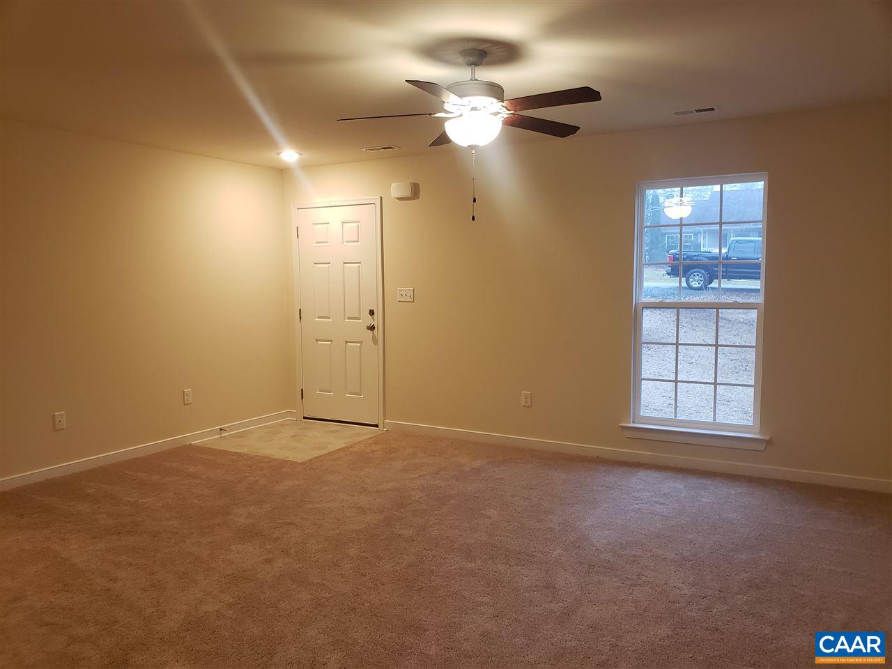 14 Haversack Road, Unit 310/5 Palmyra, VA 22963 - Photo 3 of 47 en empty room with windows and fan