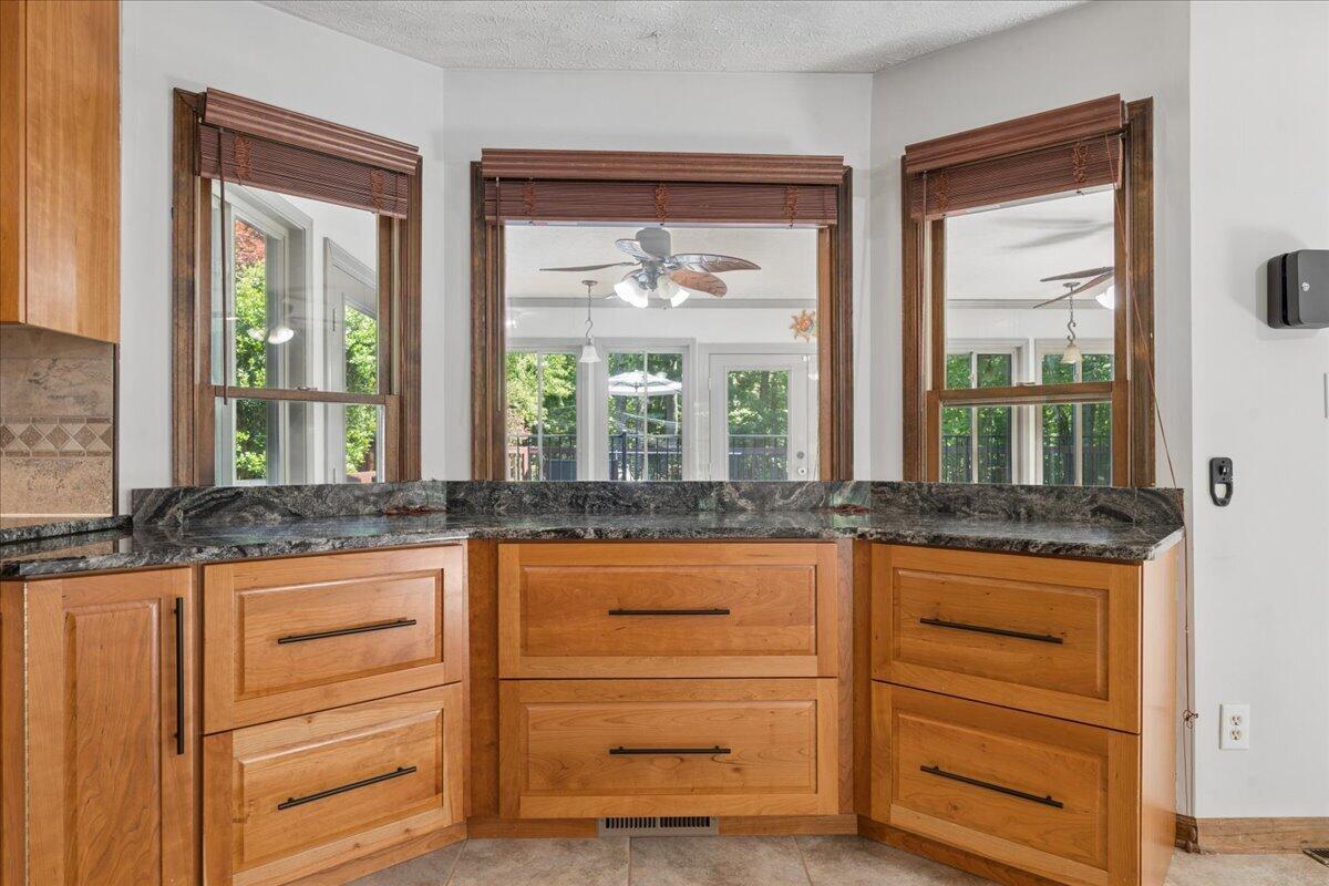 431 Langdon Road Evington, VA 24550 - Photo 9 of 54 a kitchen with granite countertop a large window and a sink