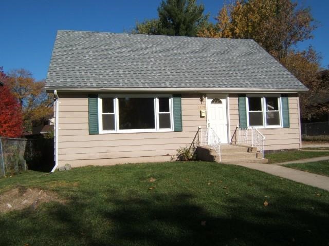 3908 Louisiana Road Rockford, IL 61108 - Photo 1 of 22 a front view of a house with a yard