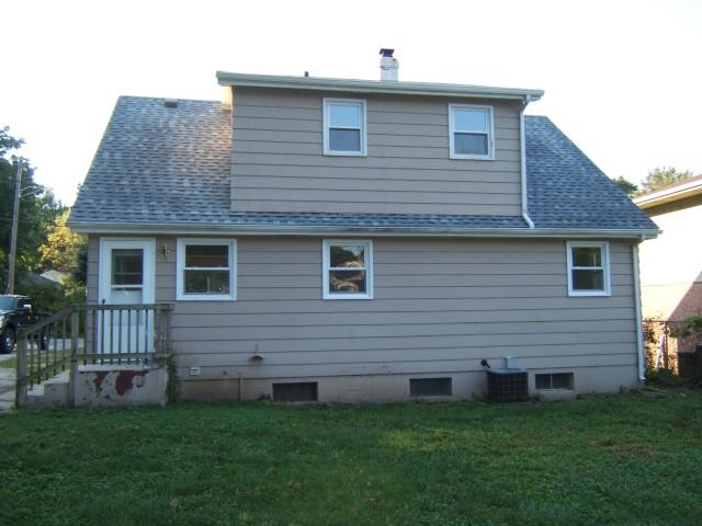 3908 Louisiana Road Rockford, IL 61108 - Photo 8 of 22 a front view of a house with a garden